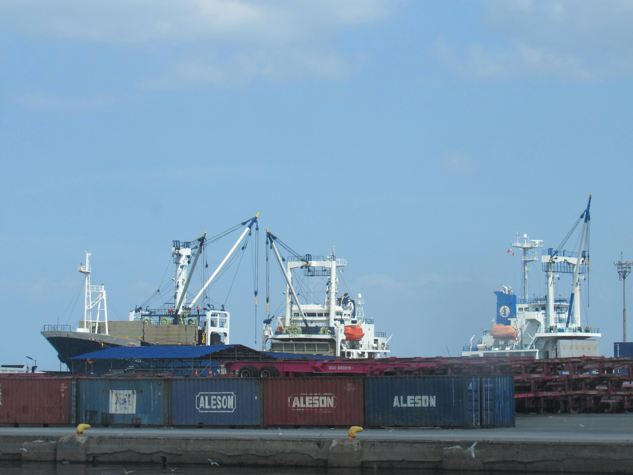 Cargo ships and shipping containers at a port