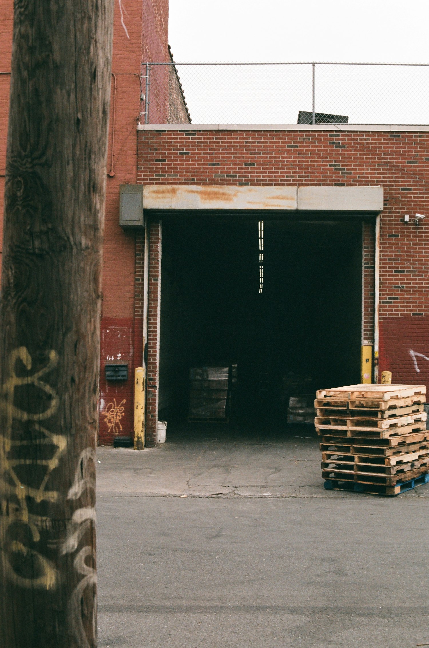 Warehouse loading dock with stacked wooden pallets